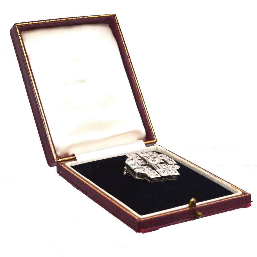 Art Deco platinum 7 carat diamond brooch displayed in original case with a pearl necklace attachment.