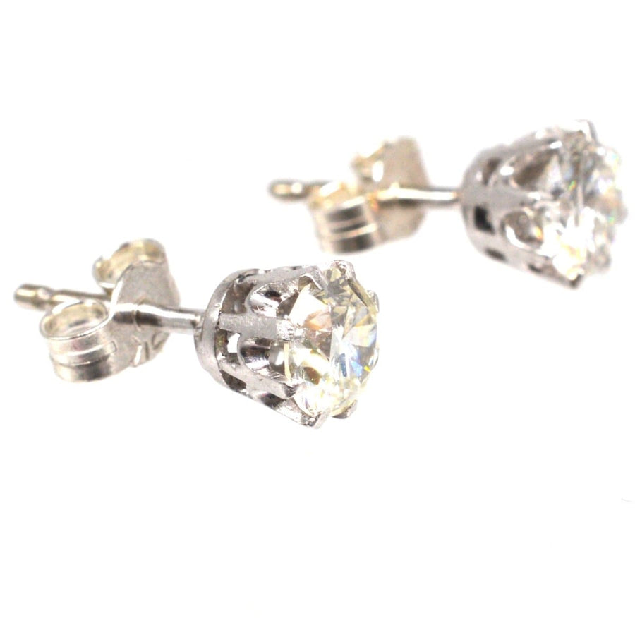 Art Deco platinum diamond stud earrings, stylish and elegant, suitable for formal and casual events.