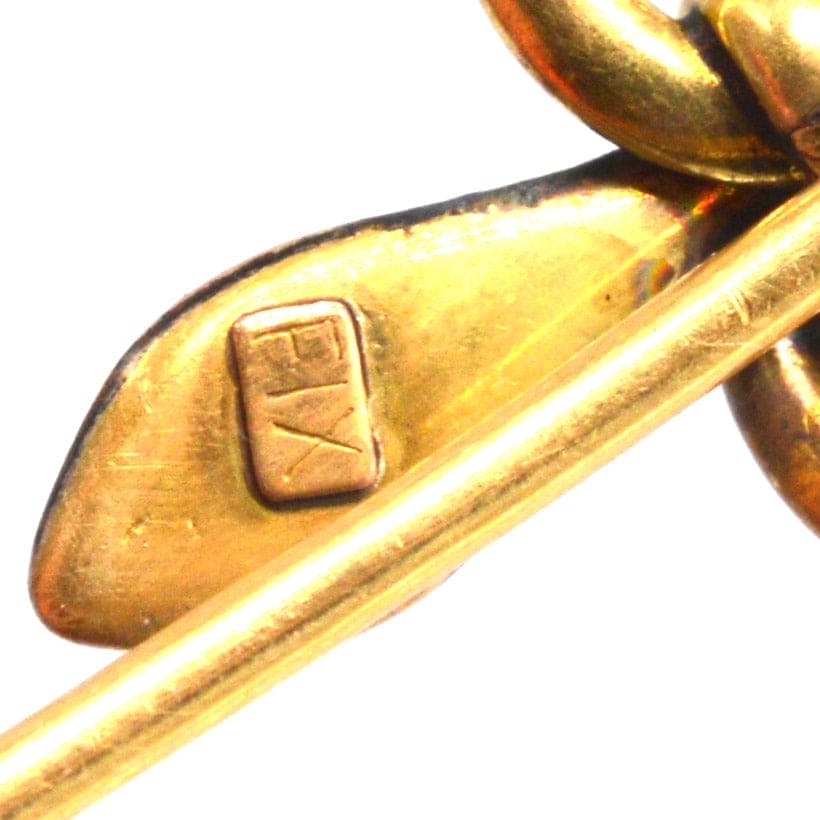 Close-up of Art Nouveau gold snake tie pin showcasing the 'FIX' hallmark and craftsmanship details.