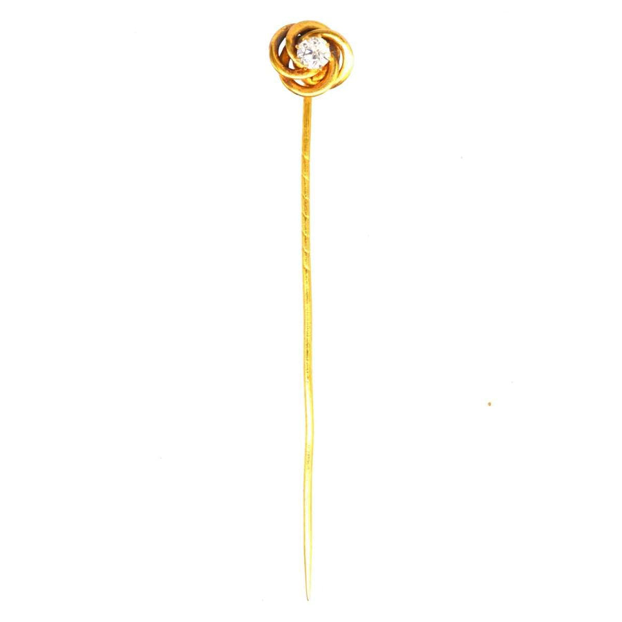 Early 20th century 14ct gold knot tie pin accented with a diamond, symbolizing strength and eternity.