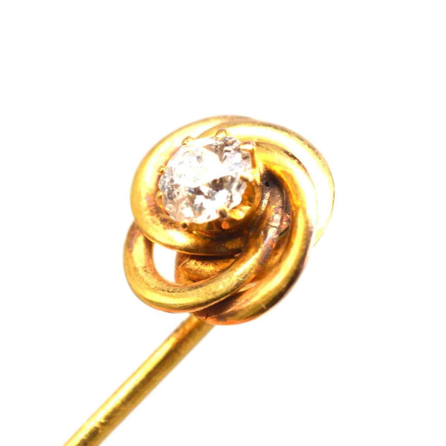 14ct gold knot tie pin featuring a sparkling diamond, symbolizing strength and eternity, perfect for gifts and formal wear.