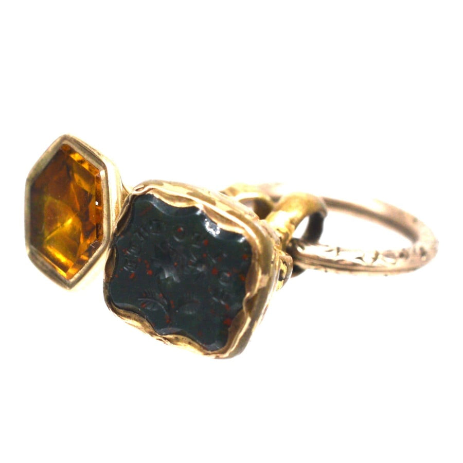 Two early Victorian gold cased seals with citrine and bloodstone, featuring a split ring for attachment.