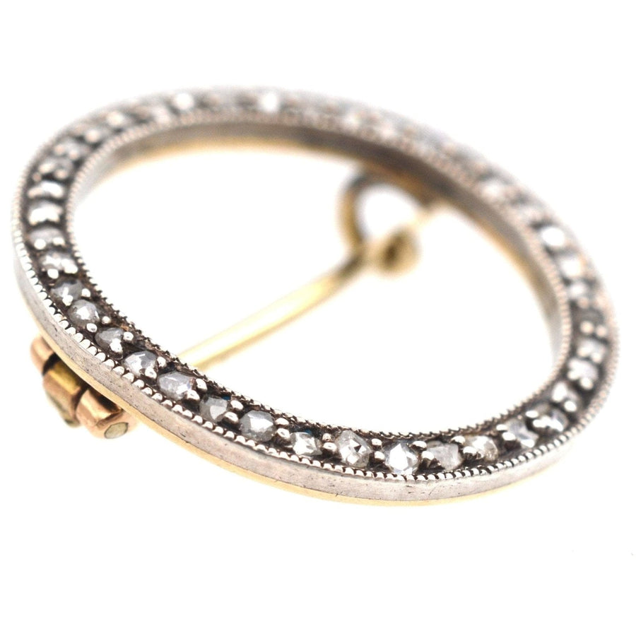 Art Deco 15ct gold and platinum brooch featuring rose cut diamonds in a circular design, stylish for lapels or ties.