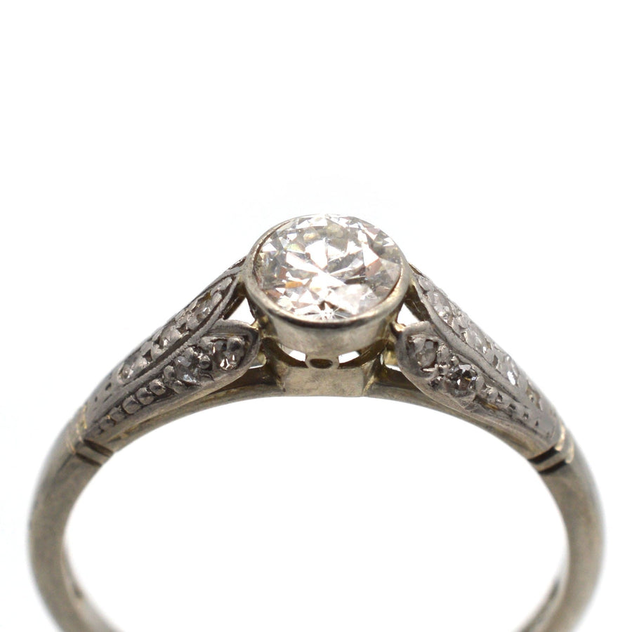 Art Deco 18ct gold diamond solitaire ring with petal details and engraved 'Ethel - John', 0.40 carats.