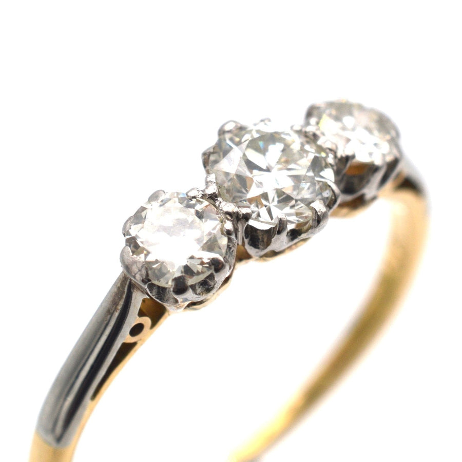 Art Deco platinum and 18ct gold diamond three stone ring, featuring clear white diamonds, perfect for engagement.