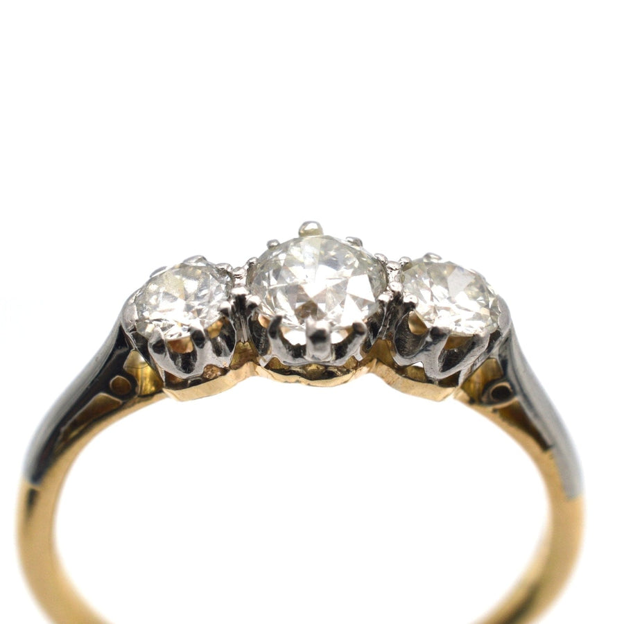 Art Deco platinum and 18ct gold diamond three stone ring, featuring clear, sparkling diamonds, perfect for an engagement.