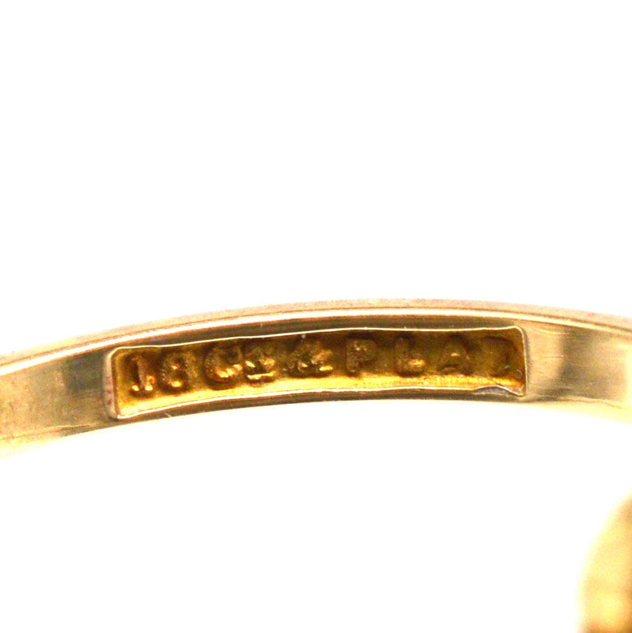 Close-up of the inner band showing the 18ct gold and platinum hallmark of the Art Deco sapphire and diamond ring.