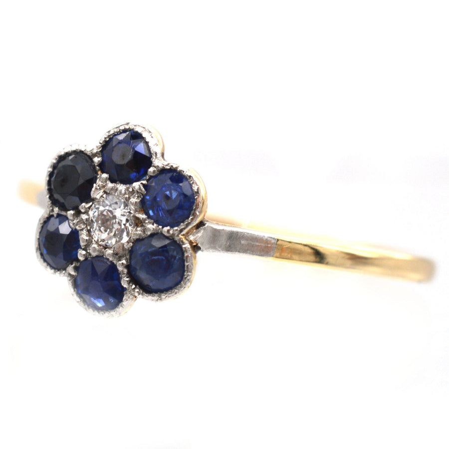 Edwardian 18ct gold and platinum flower cluster ring with sapphires and diamond, circa 1910 engagement ring.