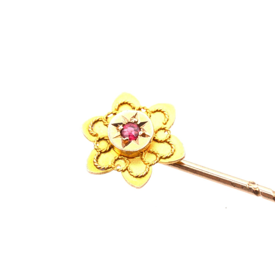 Edwardian 9ct gold flower tie pin with ruby center, stylish accessory from circa 1900s.