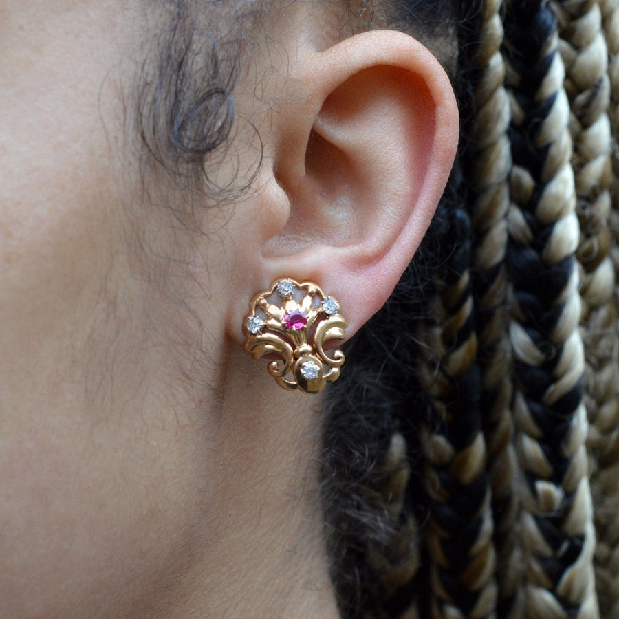 Elegant French Belle Époque 18ct gold ruby and diamond scallop shell clip-on earrings worn, showcasing vintage luxury.
