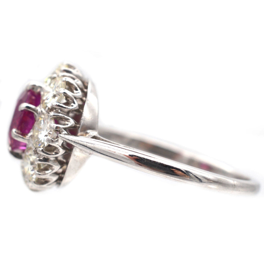 Mid 20th Century platinum ring featuring 1.7 carat Burma ruby and diamond cluster design.