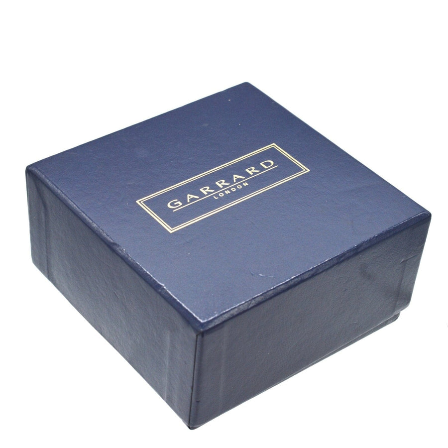 Original box for the Vintage Limited Edition Garrard travel alarm clock, featuring blue leather design with logo.